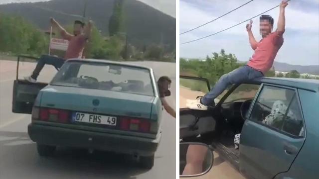 Seyir halindeki otomobilin tavanına oturdu, cezadan kurtulamadı