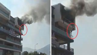 Çıkan yangından alt kattaki balkona atlayarak kurtuldu
