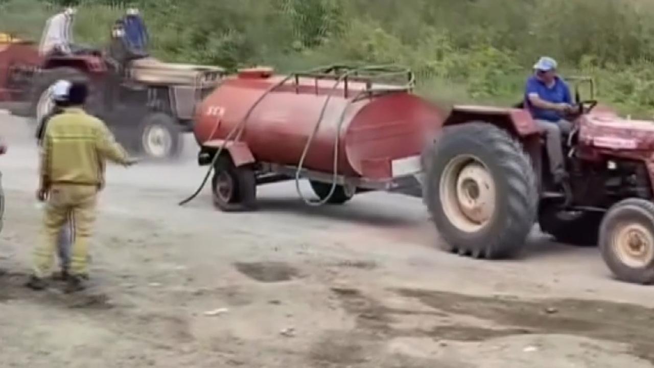 Fedakar çiftçi jant üzerinde yangına su yetiştirdi